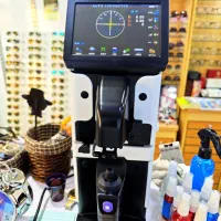 دستگاه تراش و اسکن عدسی عینک لنزومتر دکور کارگاه