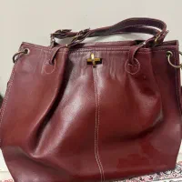 کیف دست زرشکی در حد بسیار نو