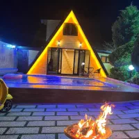 کلبه سویسی همراه با ویلای استخر دار در یک مجموعه