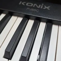 پیانو تاشو کونیکس مدل konix-pj88c لوازم کامل