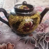 قوری وساعت دیواری