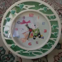 ساعت رومیزی و قاب عکس کودک