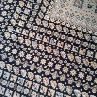 باسلام یک فرش ۱۲ متری و میز تلوزیون بزرگ شیشه ای