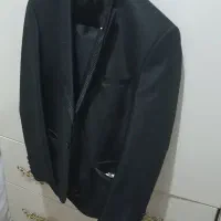 کت شلوار مردانه یک شب پوشیده شده