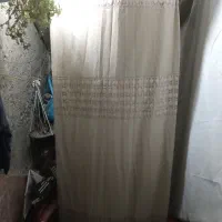 یک پرده کرم رنگ 11-12متر به فروش می رسد