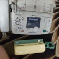 گوشی آیفون و دستگاه فکس پاناسونیک