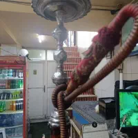 کارگر قلیان شور  وسط کار چایخانه