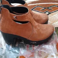 نیم بوت|کیف، کفش، کمربند|اصفهان, باغ فدک|دیوار