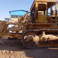بلدوزرمعاوضه با ملک و خودرو