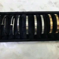 دستبند النگویی کارتیر دارای طرح های متفاوت بدلیجات