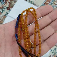 تسبیح کهربا قواره ریز تاجری ۲۵سانتی