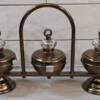 قندان و جای شکلات روی کنسولی و روی میزی فلزی