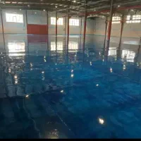 بتن ریزی کف با ماله پروانه و دوربین تراز لیزری