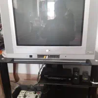 تلویزیون ۲۱ اینچ  LG و میز شیشه ای تمپر شده