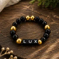 دستبند LUX مشکی و طلایی دست‌ساز و خاص