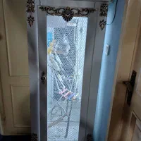 یک جفت عروس هلندی با  گنجه قفس