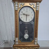 ساعت دیواری آونگ دار