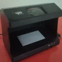 دستگاه تشخیص اسکناس تقلبی