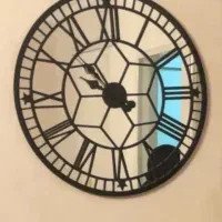 ساعت دیواری آینه‌ای مدرن