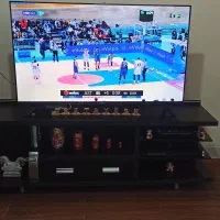 میز تلویزیون مشکی MDF و استیل و شیشه ،پایه استیل