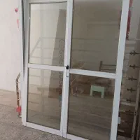 درب کشویی ریلی باشیشه ی دوجداره 140در210کاملآ سالم