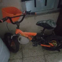 دوچرخه ۱۶ نارنجی صحیح سالم همراه بایک اسکوتر