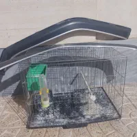 قفس پرنده با تمام لوازم و بادگیر شیشه پراید سالم