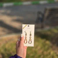 گوشواره آویزان طلایی رنگ بسیار زیبا برند. Tosch