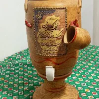 کــوزه جای آب