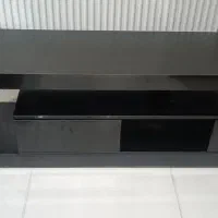 زیر تلویزیونی ساعت دیواری