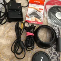 دوربین 50dکنون با لنز ۱۸۲۰۰ و سه پایه