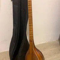 سه تار بهمراه چندکتاب آموزشی|سازهای سنتی|نور, |دیوار