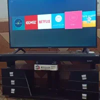 یک عدد تلویزیون و گیرنده و میز