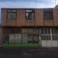 خانه دوطبقه قابل سکونت و دو دهنه مغازه تجاری