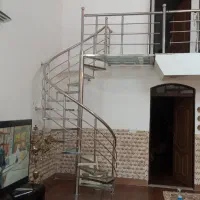 پله پیچ آهنی حفاظ استیل نمای‌ اسپایدر درب استیل