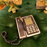 دوربین عکاسی Canon و تلفن مانیتوری